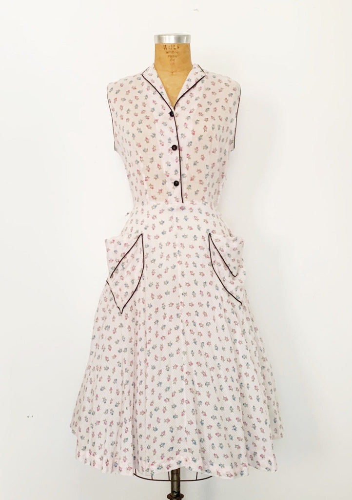1950s vintage sleeveless fit-and-flare dress in a pink basket novelty print